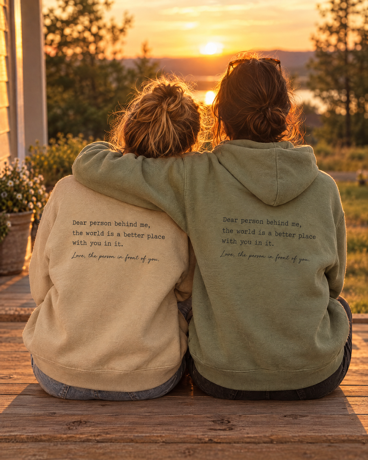 Two friends wearing the message hoodies